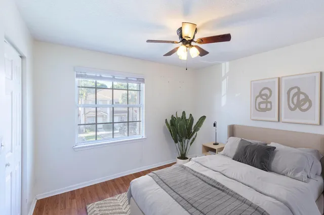 a view of an empty room and wooden floor