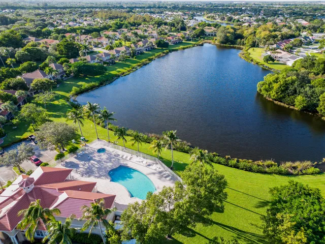 an aerial view of house with yard swimming pool and outdoor seating