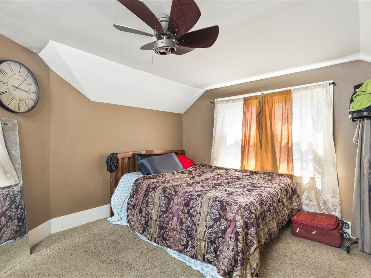 1247 West Logan Street Freeport, IL 61032 - Photo 23 of 34 a bedroom with a bed and a chandelier