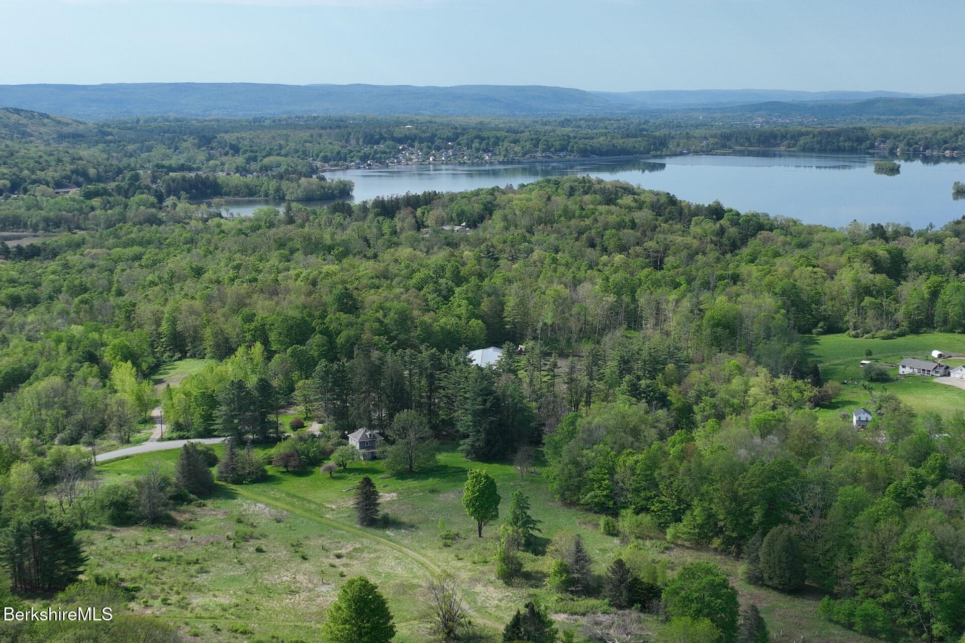 80 Miner Road Lanesborough, MA 01237 - Photo 3 of 10 a view of a field with trees in the background
