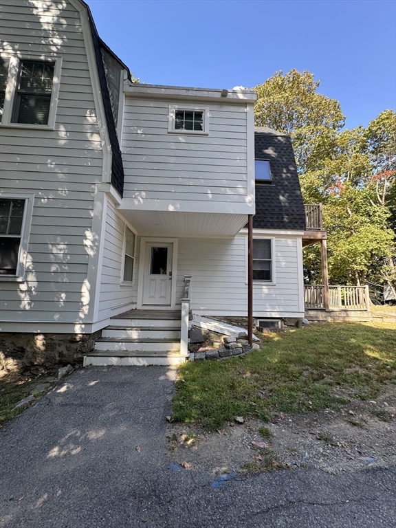 62 Crosby Road, Unit 1 Newton, MA 02467 - Photo 11 of 12 a front view of a house with garden