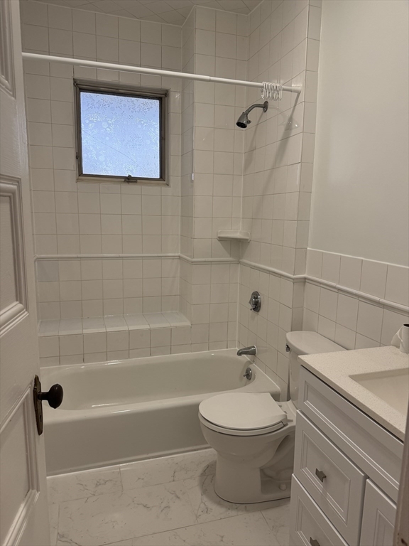62 Crosby Road, Unit 1 Newton, MA 02467 - Photo 6 of 12 a bathroom with a toilet a sink and shower