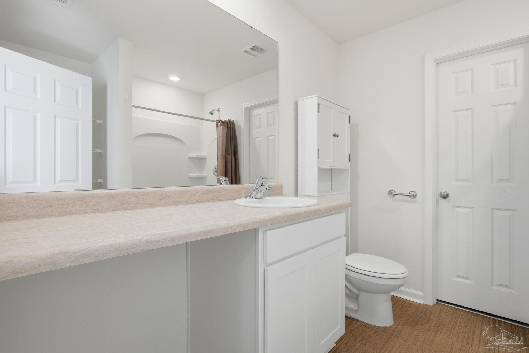 7804 Maxton Road Pensacola, FL 32514 - Photo 11 of 20 a bathroom with a sink a toilet and shower