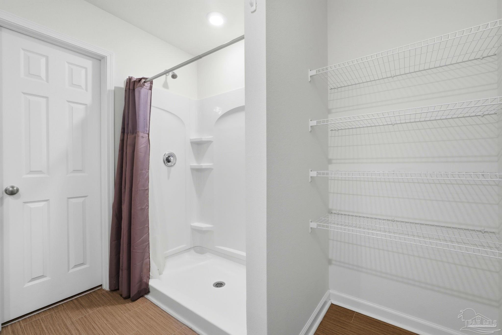 7804 Maxton Road Pensacola, FL 32514 - Photo 12 of 20 a bathroom with a shower and a glass door
