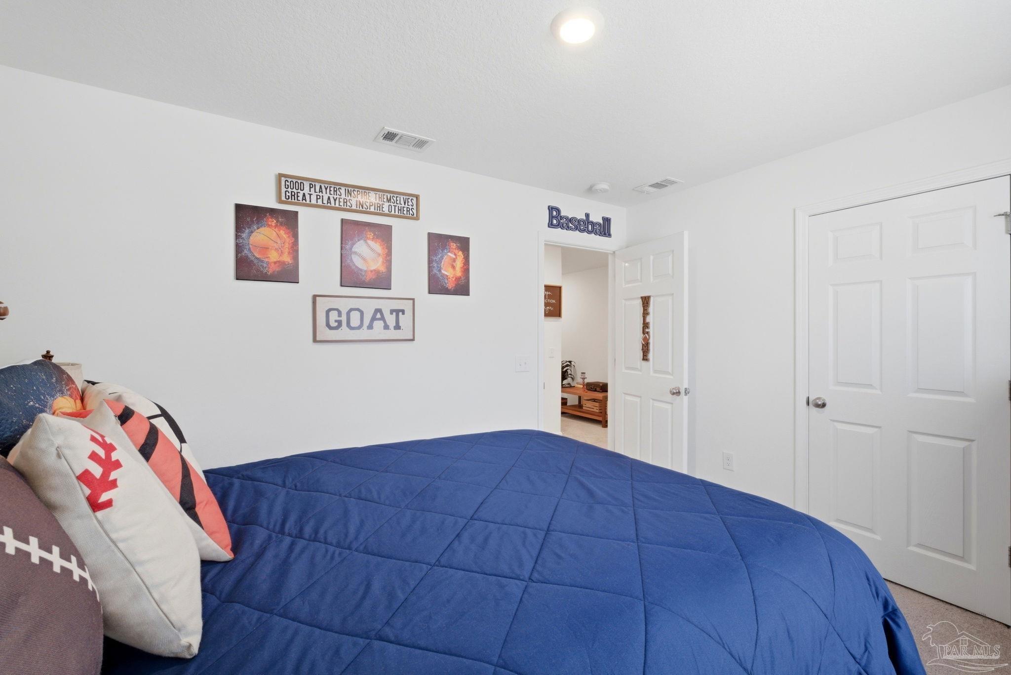 7804 Maxton Road Pensacola, FL 32514 - Photo 14 of 20 a bedroom with a bed and a window