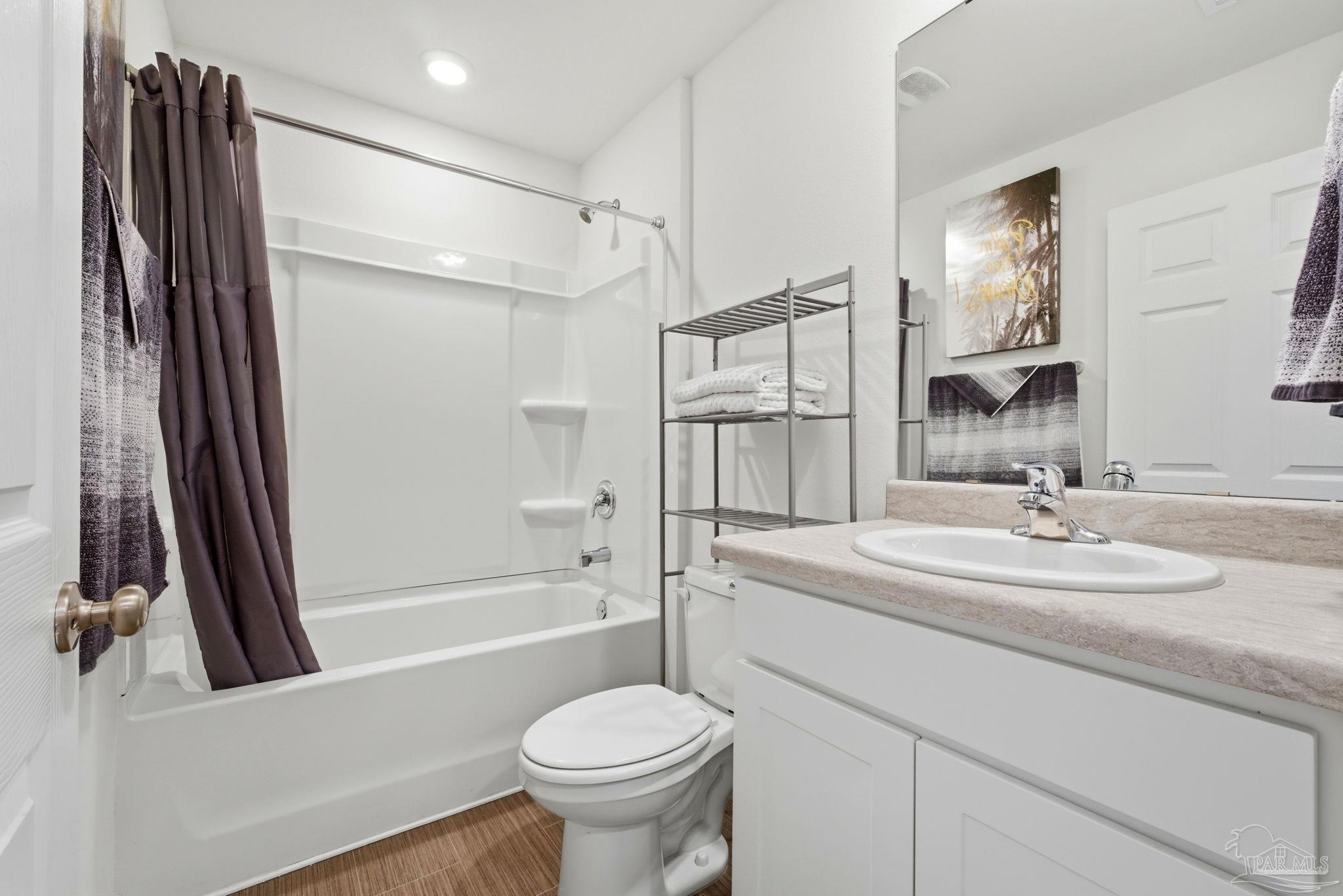 7804 Maxton Road Pensacola, FL 32514 - Photo 15 of 20 a bathroom with a sink toilet and shower