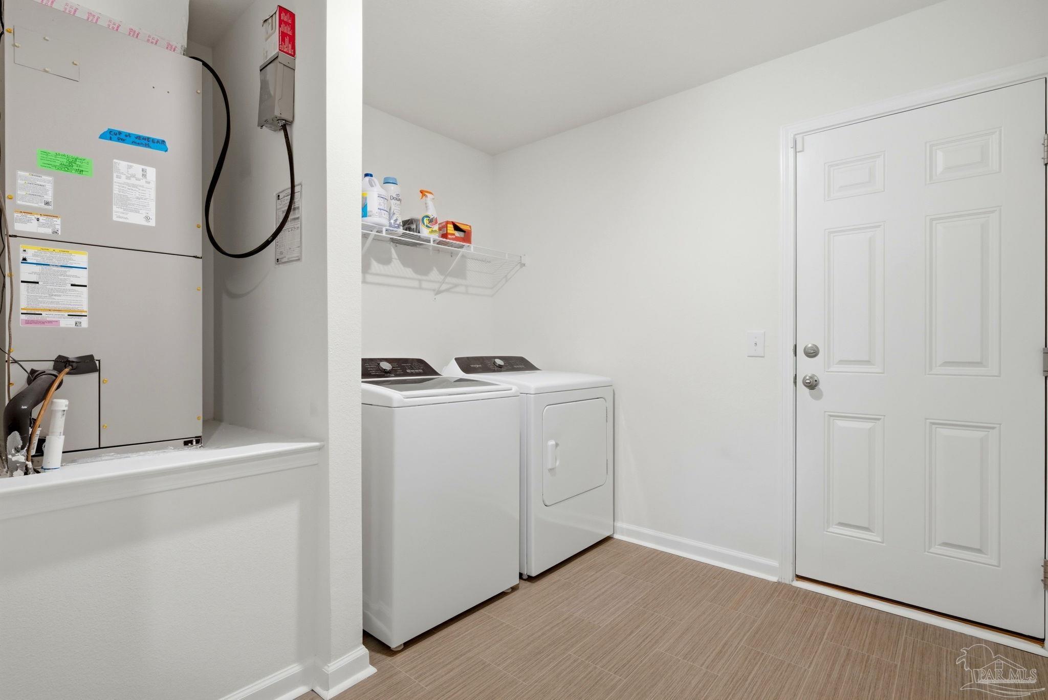 7804 Maxton Road Pensacola, FL 32514 - Photo 18 of 20 a room with a washer and dryer