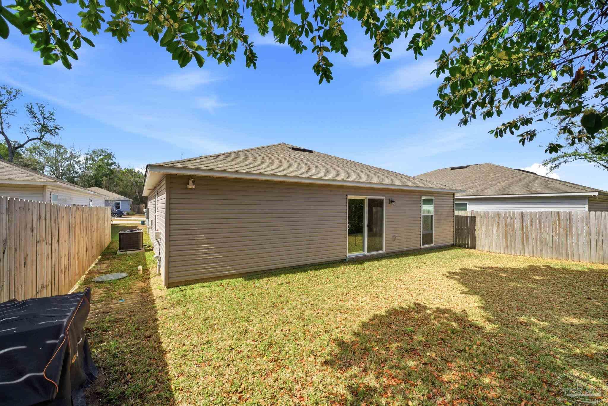 7804 Maxton Road Pensacola, FL 32514 - Photo 19 of 20 a view of a house with a yard