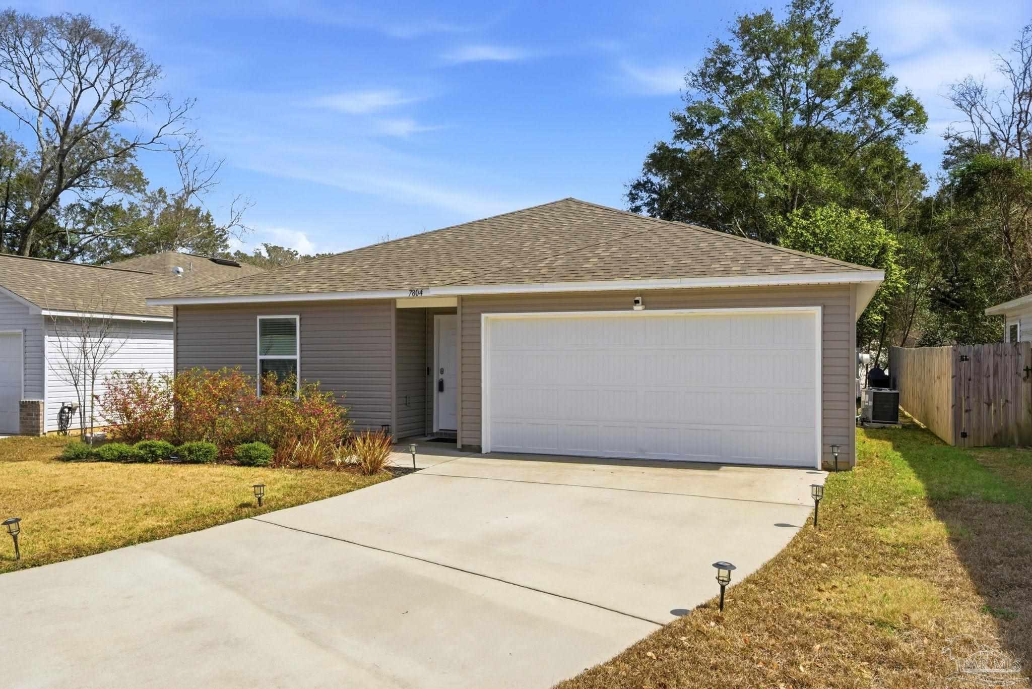 7804 Maxton Road Pensacola, FL 32514 - Photo 2 of 20 a front view of house with yard and green space