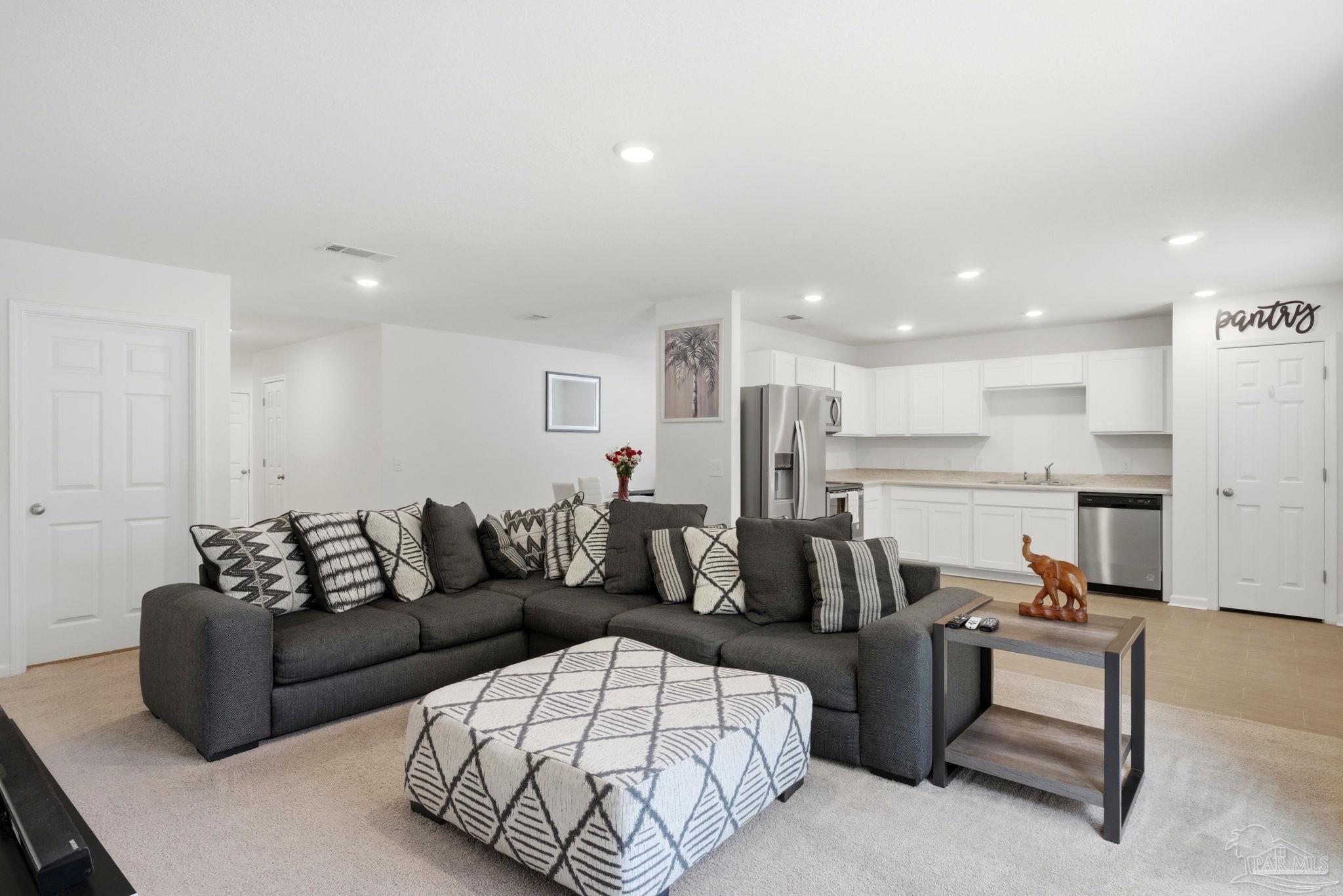 7804 Maxton Road Pensacola, FL 32514 - Photo 4 of 20 a living room with furniture and kitchen view