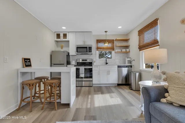 $630,000 | 111 Northeast 19th Street, Unit C & D, Oak Island, NC 28465