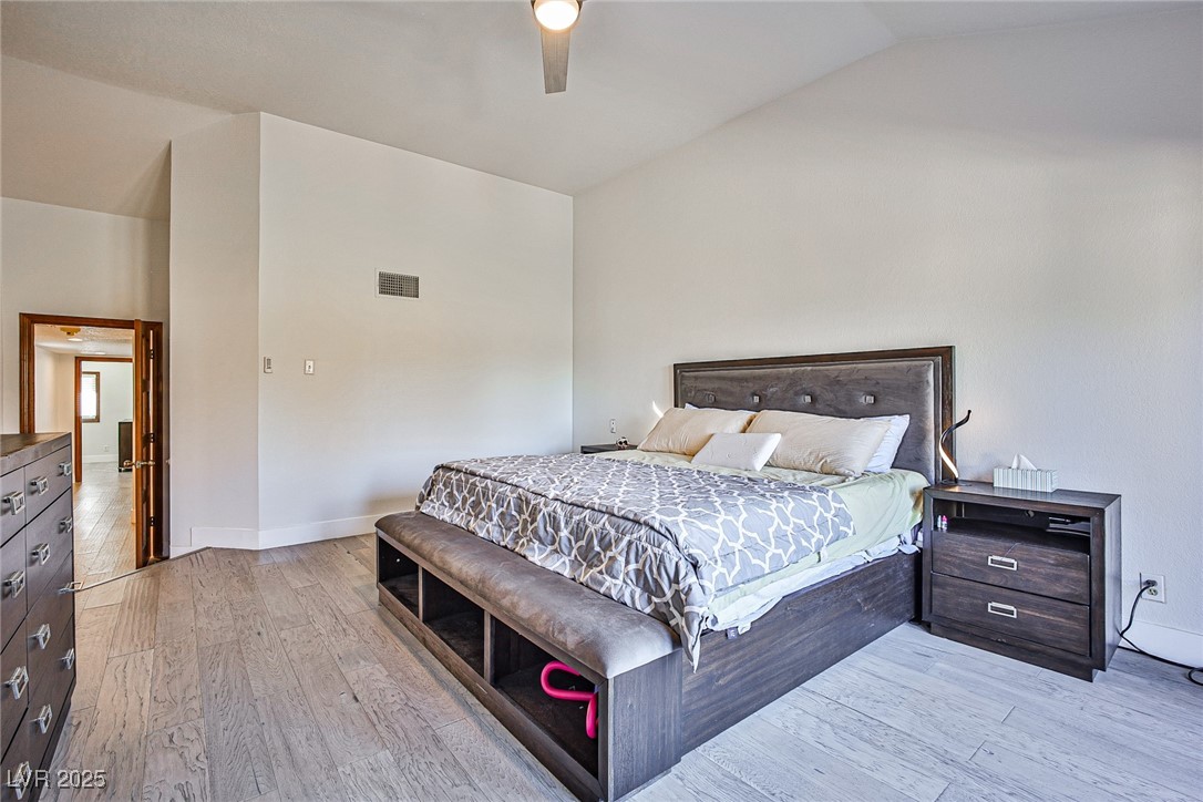 7772 Boca Raton Drive Las Vegas, NV 89113 - Photo 30 of 40 Bedroom with light wood-style floors, lofted ceiling, and ceiling fan