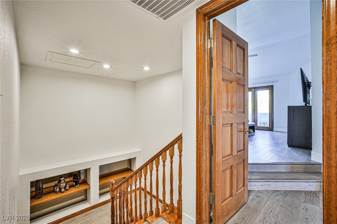 7772 Boca Raton Drive Las Vegas, NV 89113 - Photo 37 of 40 Hallway with hardwood / wood-style floors, recessed lighting, and an upstairs landing