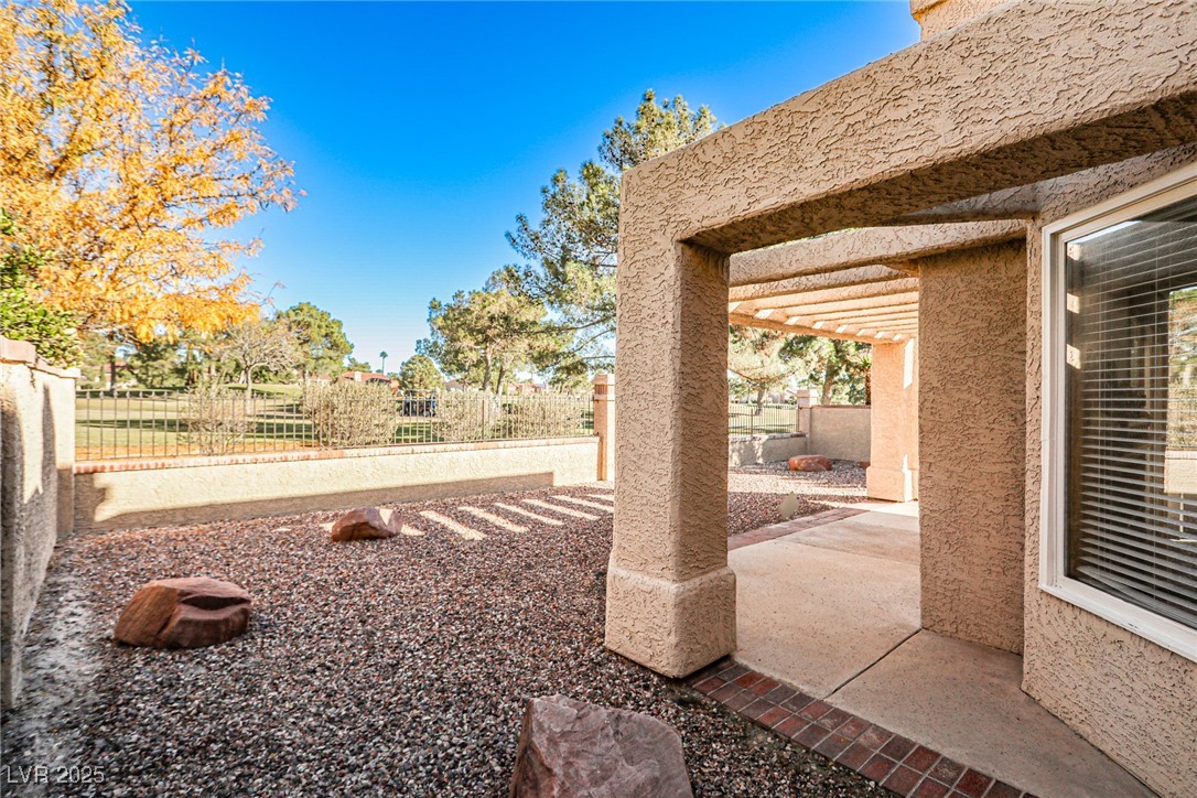7772 Boca Raton Drive Las Vegas, NV 89113 - Photo 4 of 40 Fenced backyard with a patio area