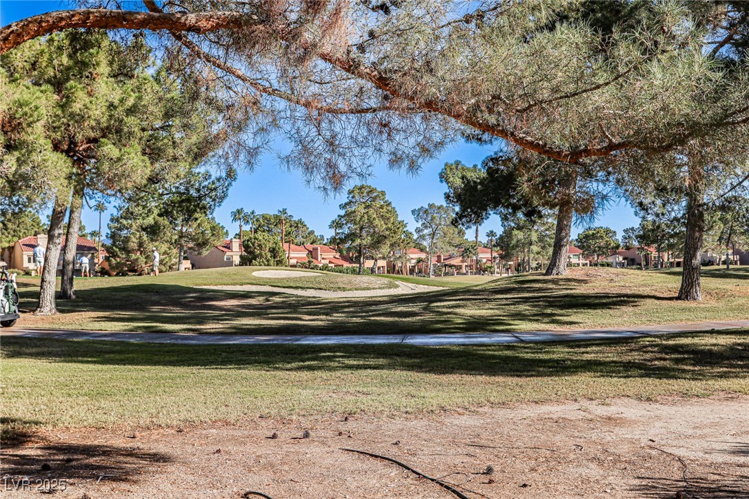 7772 Boca Raton Drive Las Vegas, NV 89113 - Photo 8 of 40 View of property's community featuring a lawn and a residential view