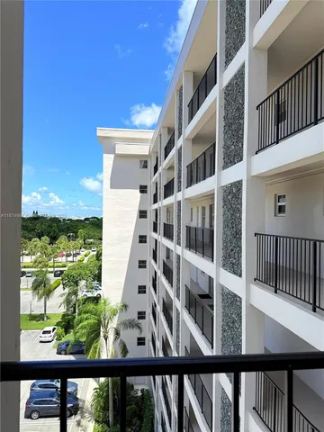 a kitchen with stainless steel appliances a stove a microwave and cabinets