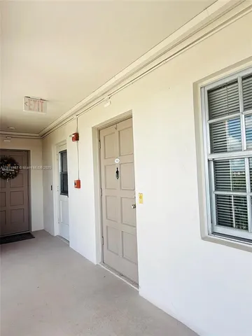 a kitchen with stainless steel appliances a stove a sink a refrigerator and cabinets