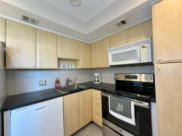 a lobby with furniture and window