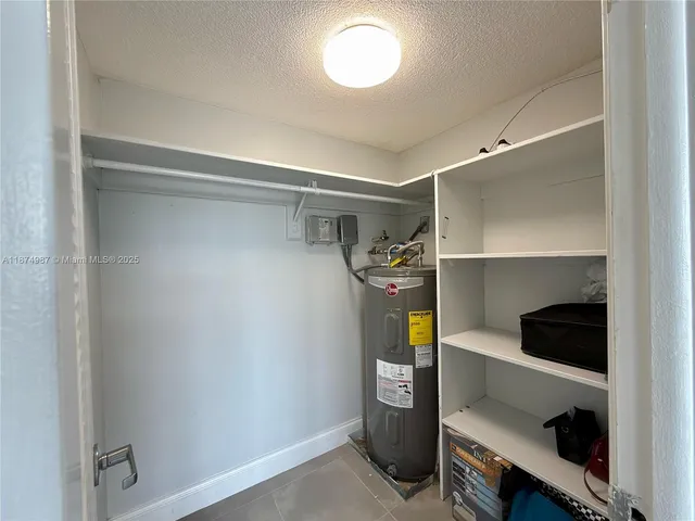 a bathroom with a toilet a sink and a mirror