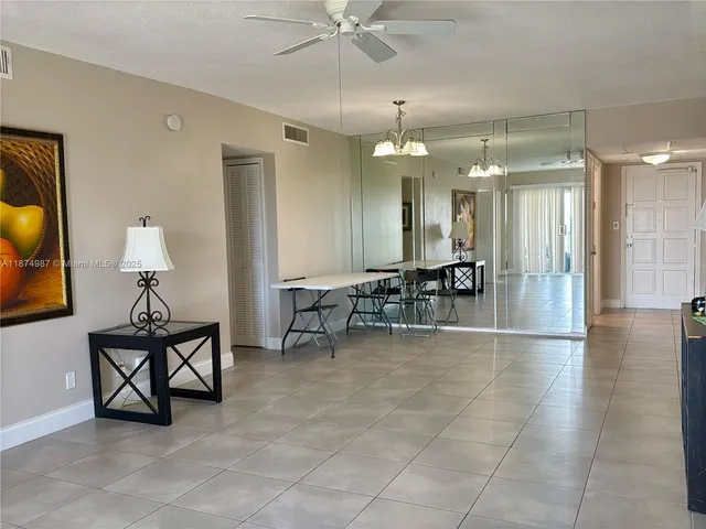 a view of a hallway with a room