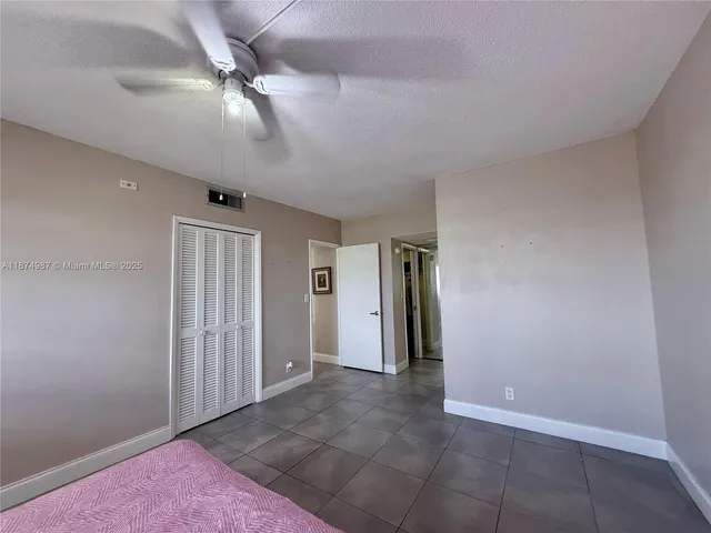 a bathroom with a shower a toilet and a sink
