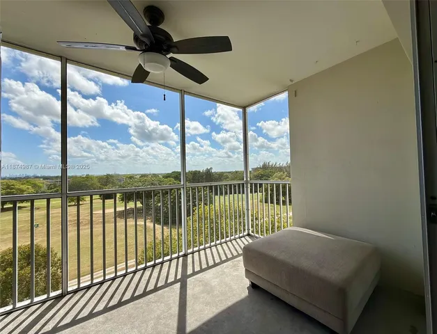 a view of a patio with table and chairs potted plants