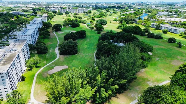 a view of kitchen with furniture and a wooden floor