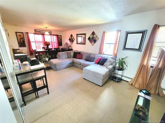 a living room with furniture or couch and a flat screen tv