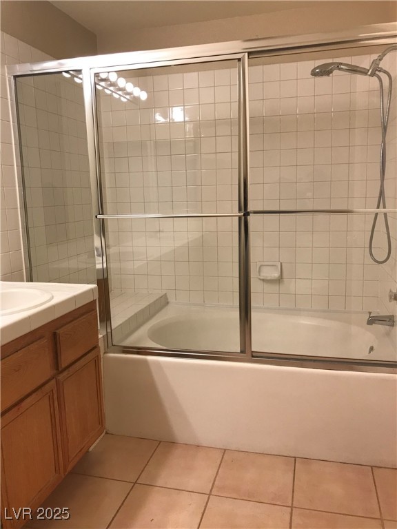5155 West Tropicana Avenue, Unit 1155 Las Vegas, NV 89103 - Photo 11 of 11 Full bathroom featuring shower / bath combination with glass door, vanity, and light tile patterned flooring