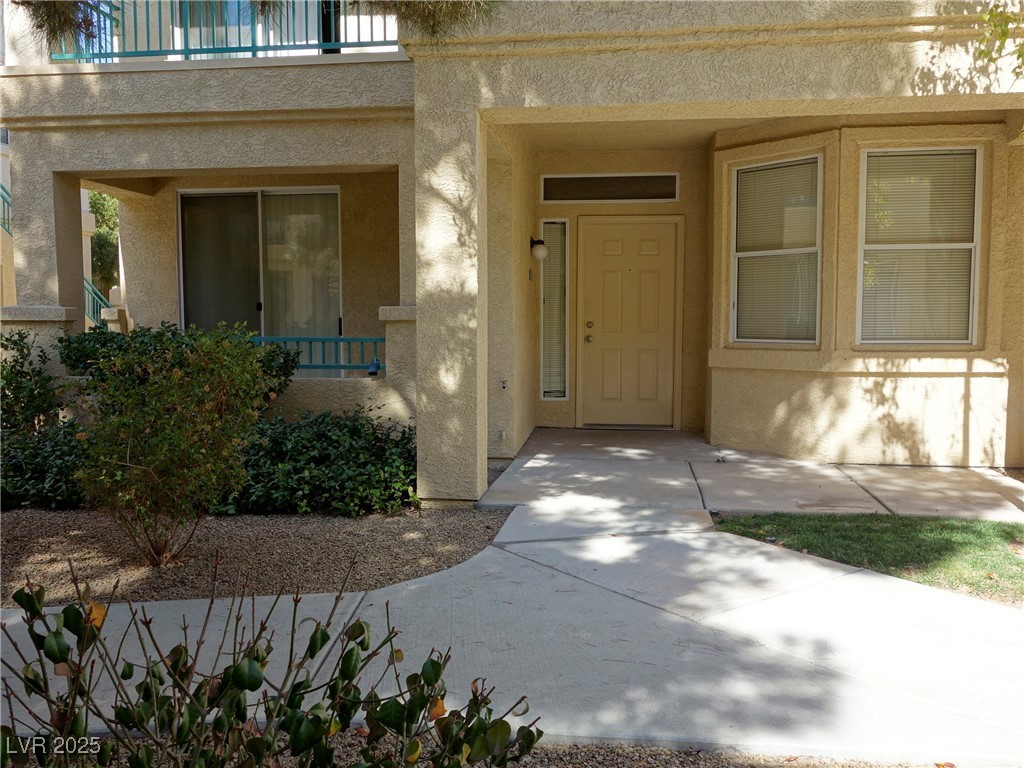 5155 West Tropicana Avenue, Unit 1155 Las Vegas, NV 89103 - Photo 2 of 11 View of exterior entry with stucco siding