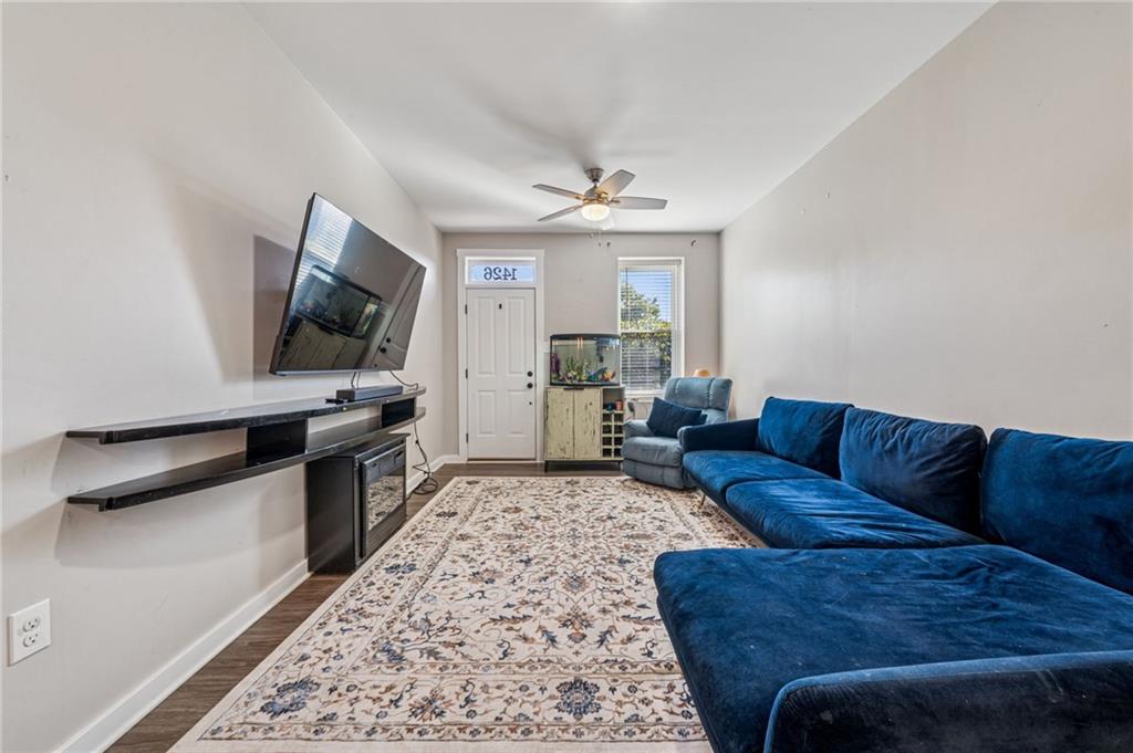 1426 Rush Street Pittsburgh, PA 15233 - Photo 11 of 30 a living room with furniture and a flat screen tv