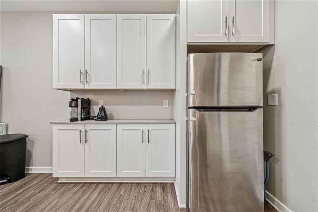 1426 Rush Street Pittsburgh, PA 15233 - Photo 18 of 30 a kitchen with a refrigerator and cabinets