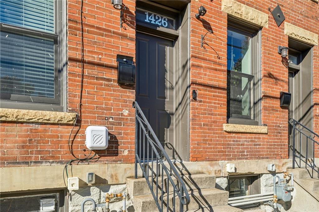 1426 Rush Street Pittsburgh, PA 15233 - Photo 2 of 30 a view of a brick house with a large window