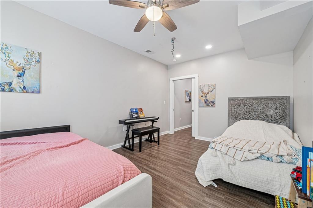 1426 Rush Street Pittsburgh, PA 15233 - Photo 22 of 30 a bedroom with a bed and a chandelier