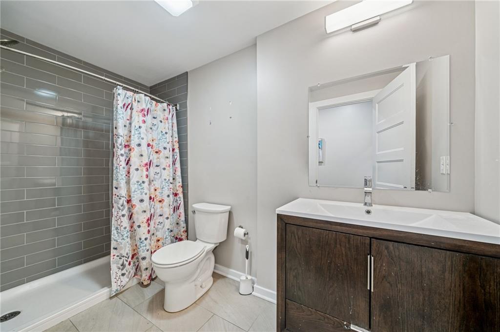 1426 Rush Street Pittsburgh, PA 15233 - Photo 23 of 30 a bathroom with a sink toilet and shower