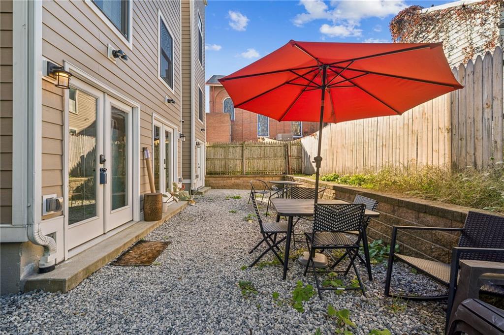 1426 Rush Street Pittsburgh, PA 15233 - Photo 30 of 30 a view of a tables and chairs under an umbrella in the patio