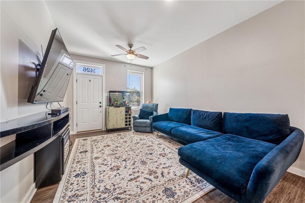 1426 Rush Street Pittsburgh, PA 15233 - Photo 10 of 30 a living room with furniture and a flat screen tv