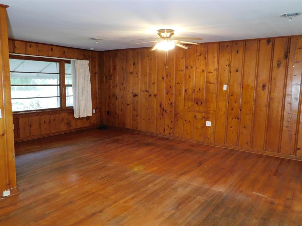 24044 Highway 157 Springhill, LA 71075 - Photo 21 of 40 wooden floor in an empty room with a window