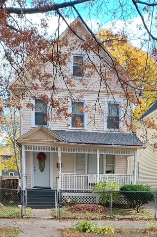 a front view of a house with garage
