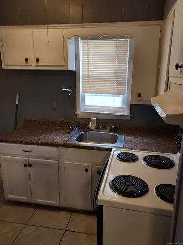 a kitchen with a stove and a sink
