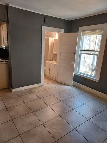 a view of an empty room with a window