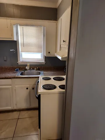 a kitchen with a stove and a sink