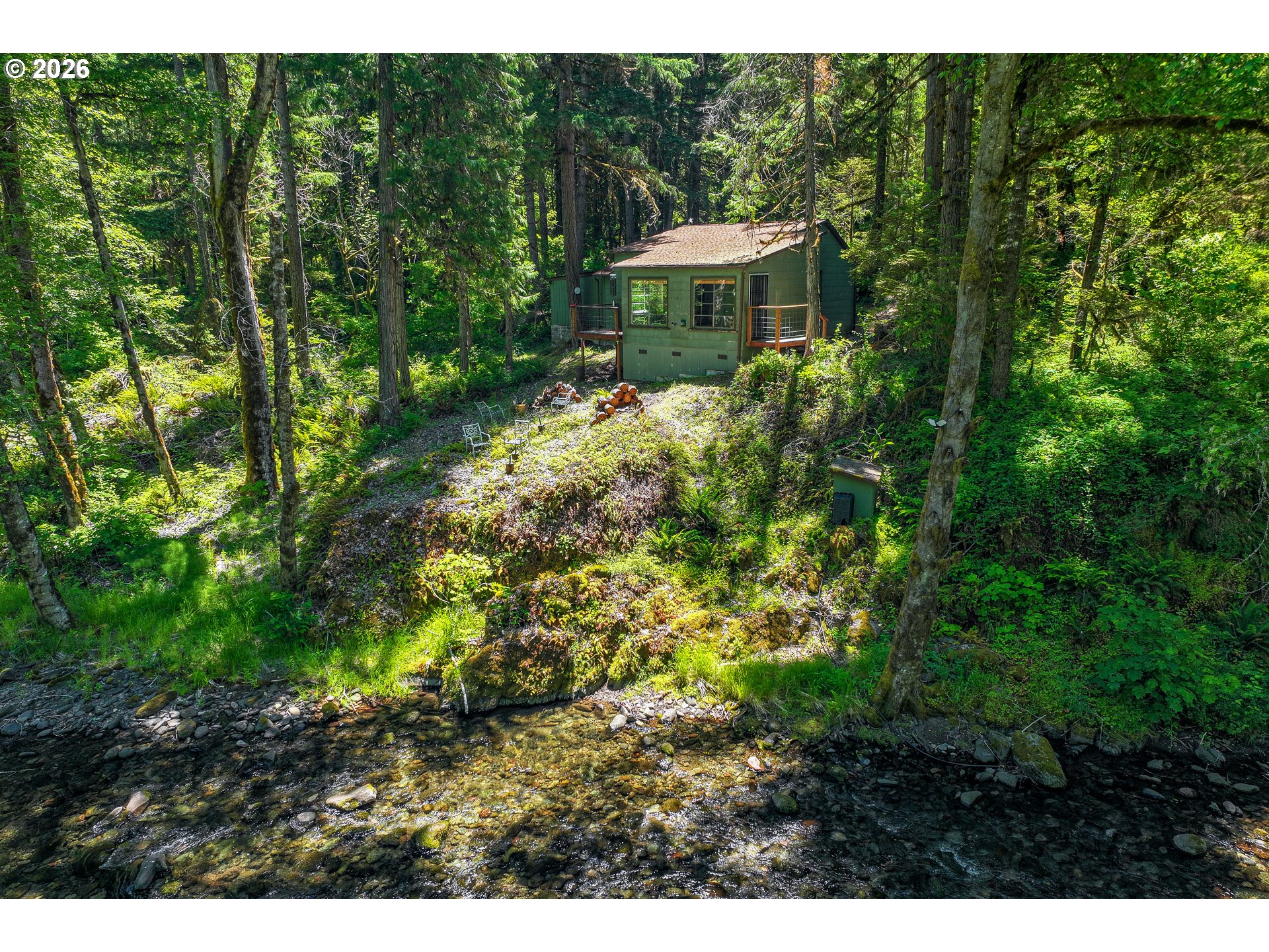 49091 Salt Creek Road Oakridge, OR 97463 - Photo 9 of 16 a view of a garden with a fountain