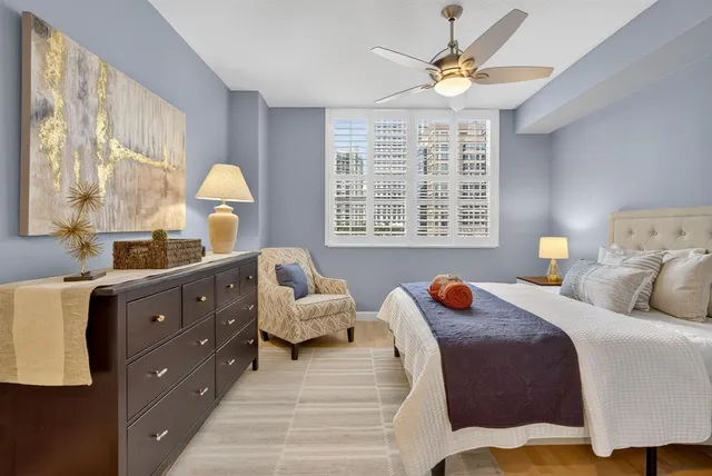 a bedroom with a bed and a dresser