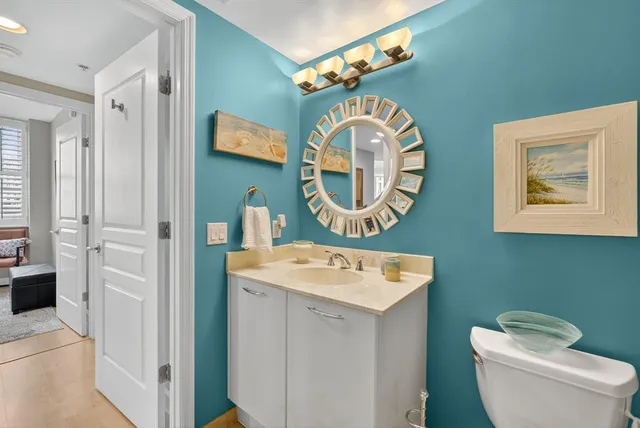 a view of a bathroom with a sink and a mirror