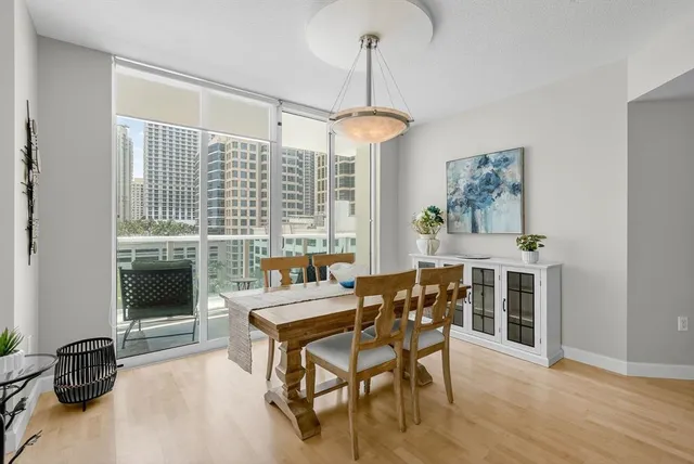 a dining room with furniture and window
