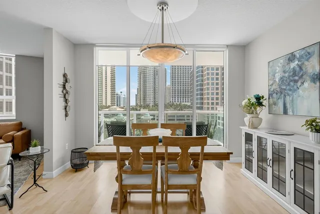 a dining room with furniture window and outside view