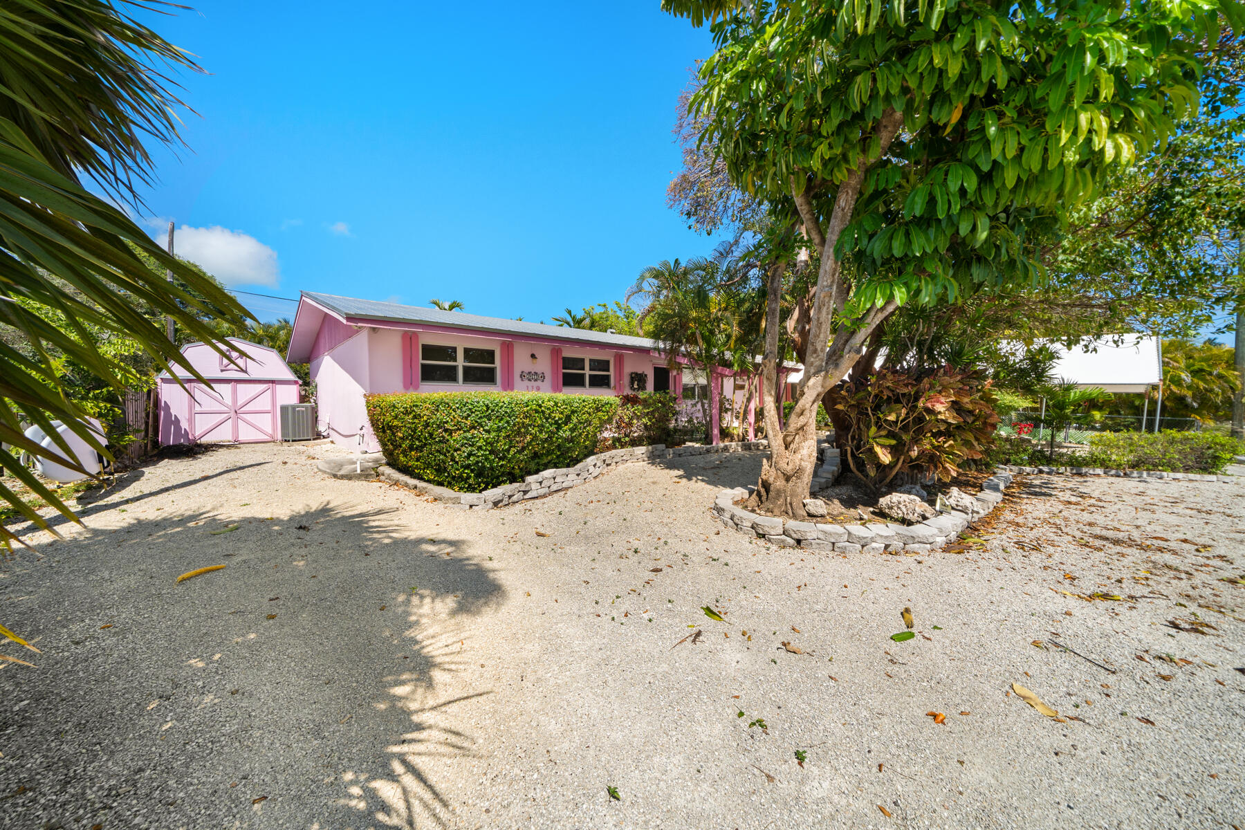 119 Bee Street Tavernier, FL 33070 - Photo 2 of 15 a front view of a house with a yard