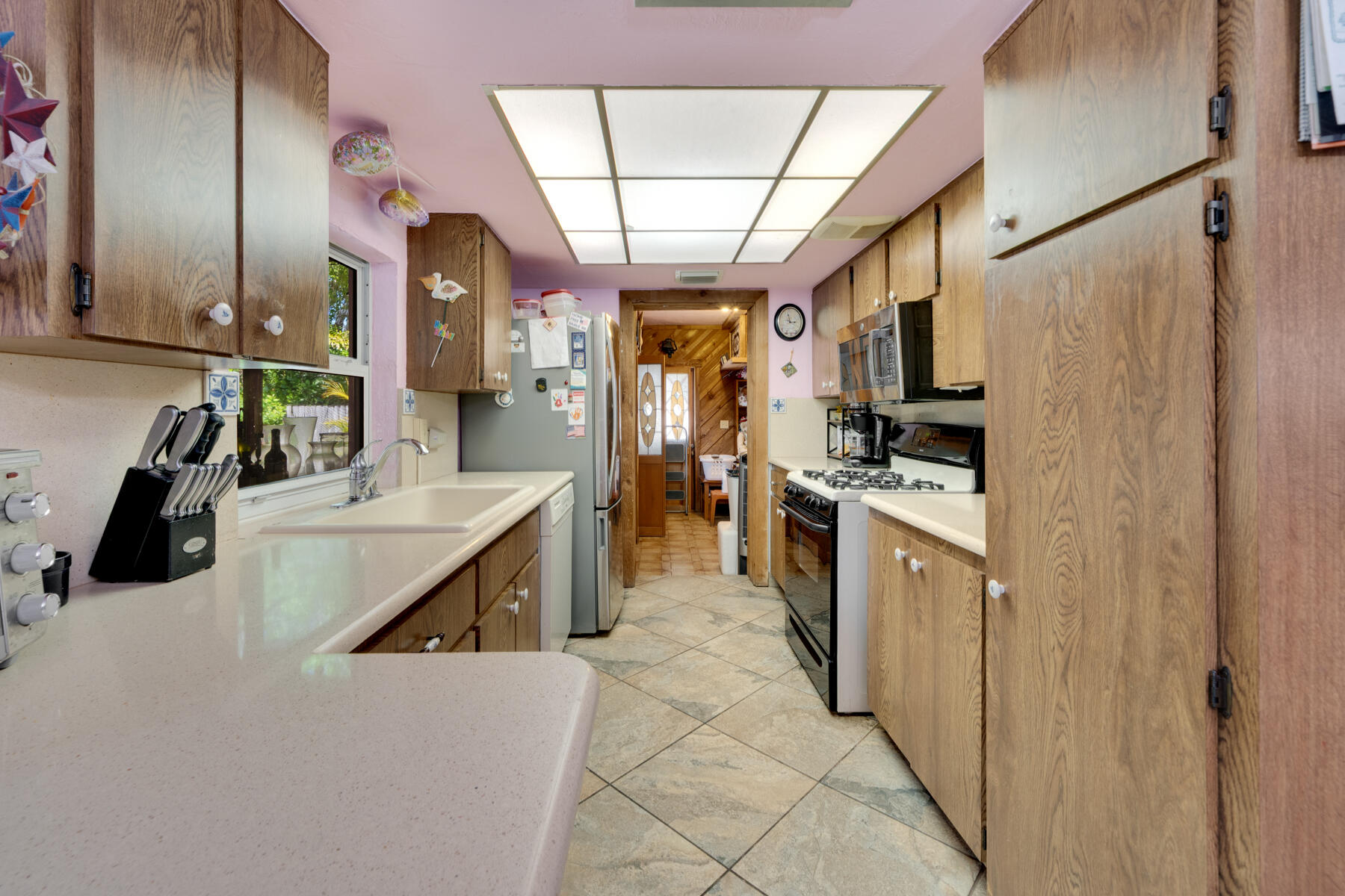 119 Bee Street Tavernier, FL 33070 - Photo 5 of 15 a kitchen with stainless steel appliances kitchen island granite countertop a refrigerator and a sink