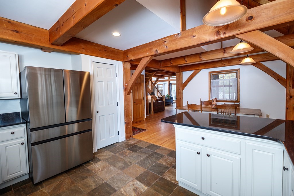77 Swamp Road Montague, MA 01351 - Photo 13 of 35 a kitchen with stainless steel appliances granite countertop a refrigerator and a sink